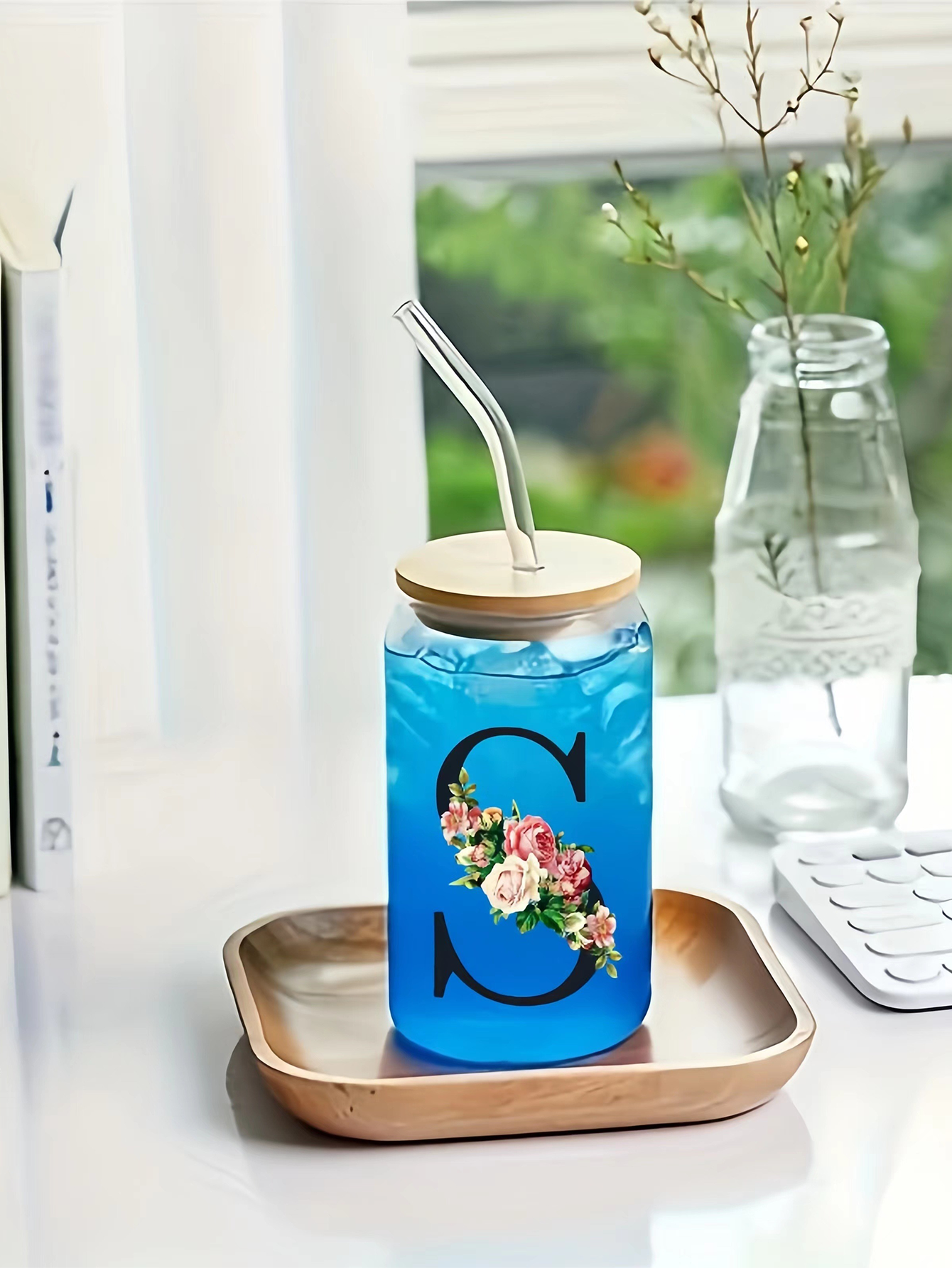 A personalized gift, featuring custom lettering, a bamboo lid and straw—a thoughtful gift, a stylish cup, and a trendy mug.